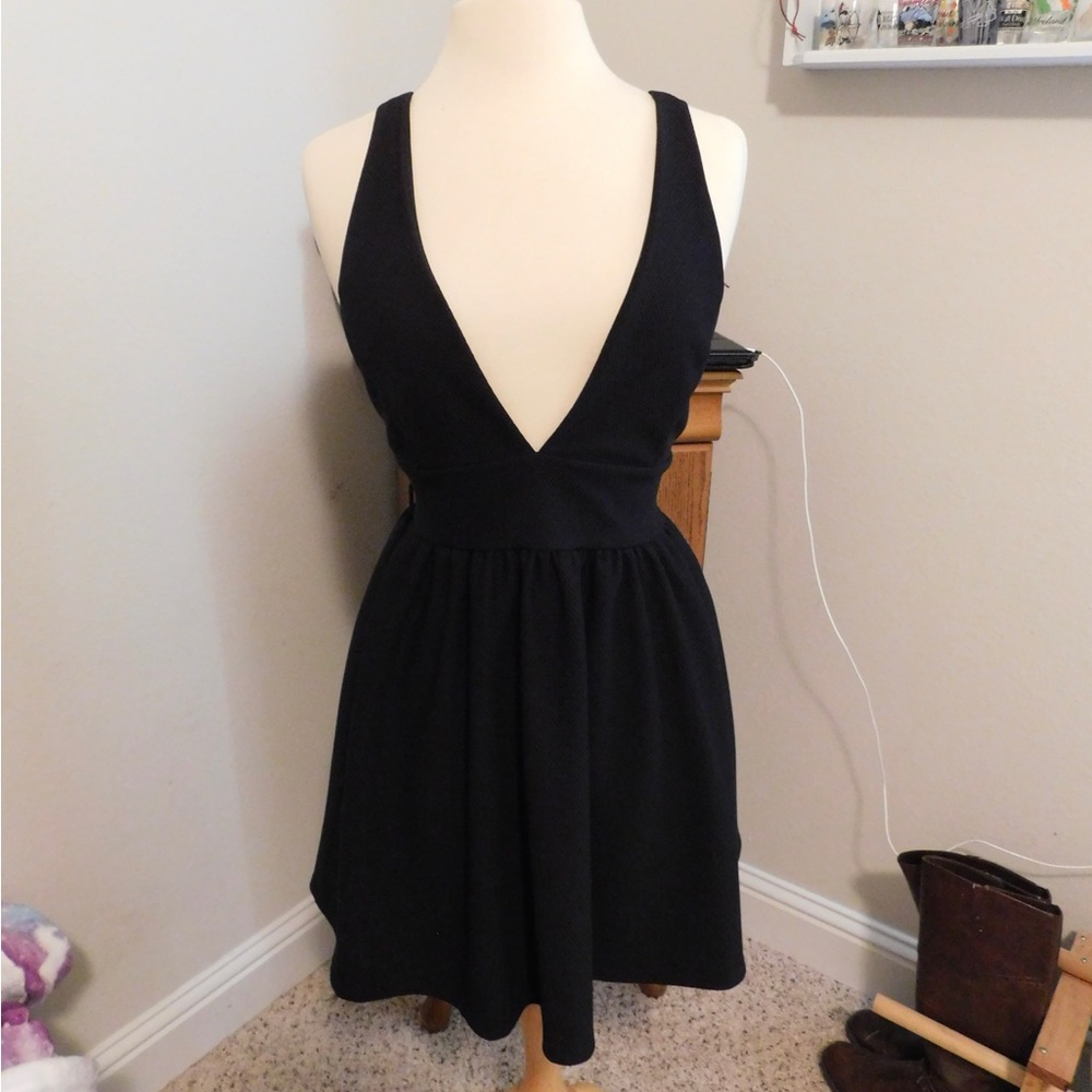 Solemio Black backless and low cut cocktail dress